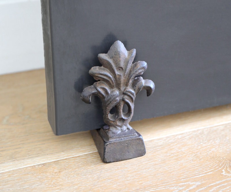 Fleur de Lys Door Wedge - Cast Iron Door Stop